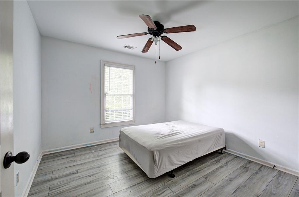 561 Holland Road Dallas, GA 30157 - Photo 22 of 48 a bedroom with a bed and window