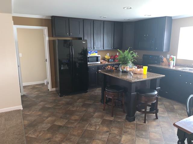 1136 Wrights Mill Road Spring Hill, TN 37174 - Photo 2 of 19 a kitchen with refrigerator and cabinets