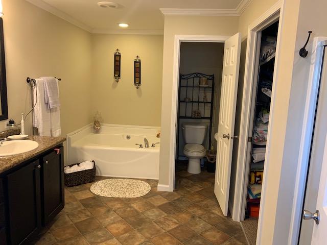 1136 Wrights Mill Road Spring Hill, TN 37174 - Photo 12 of 19 a bathroom with a granite countertop sink toilet and shower