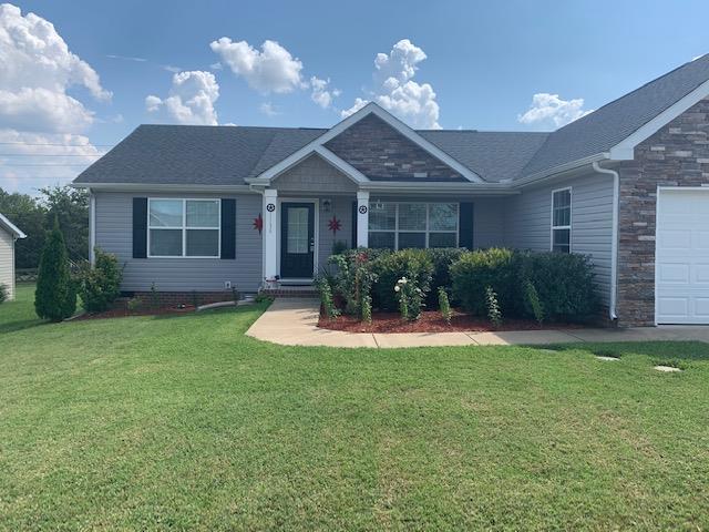 1136 Wrights Mill Road Spring Hill, TN 37174 - Photo 19 of 19 a front view of a house with a yard and potted plants