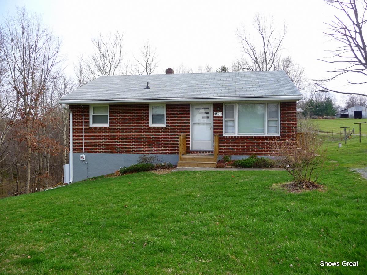 1506 Drewrys Hill Road Goodview, VA 24095 - Photo 1 of 1 a front view of a house with a yard