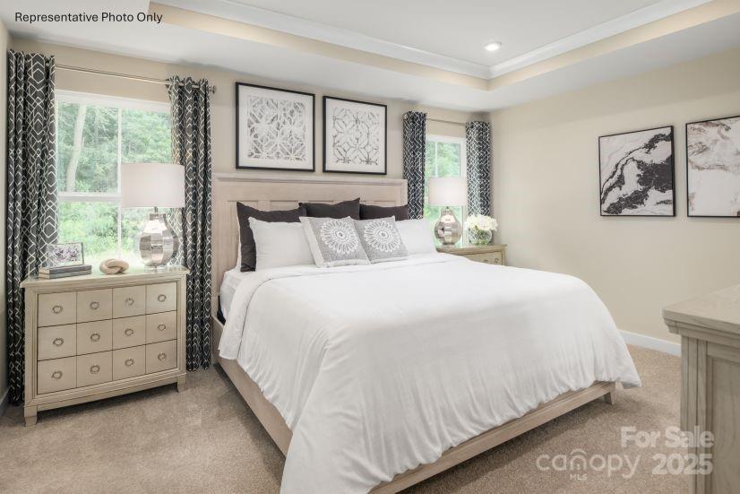 2184 Flicker Road, Unit 1036D Indian Land, SC 29707 - Photo 6 of 17 a bedroom with a bed and a window