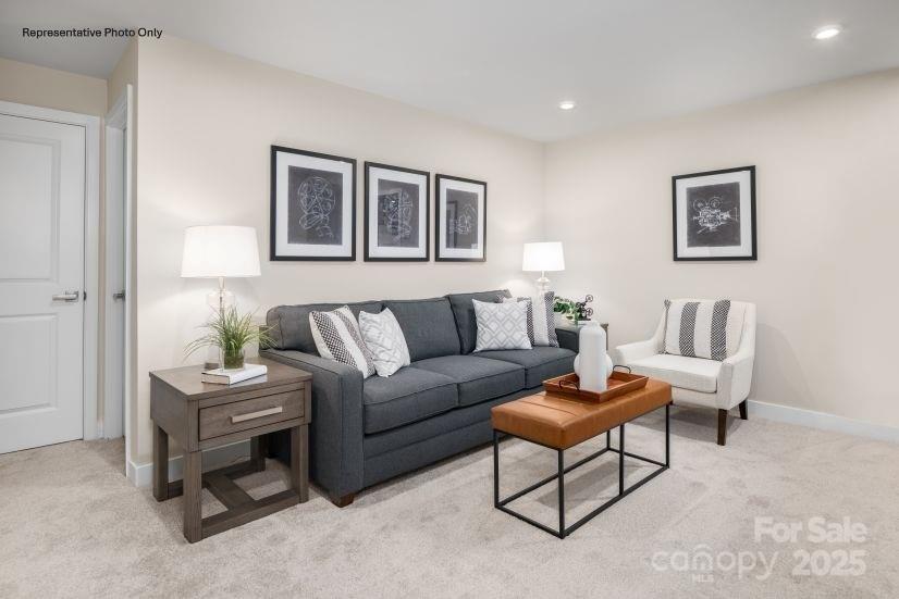 2184 Flicker Road, Unit 1036D Indian Land, SC 29707 - Photo 8 of 17 a living room with furniture and a table