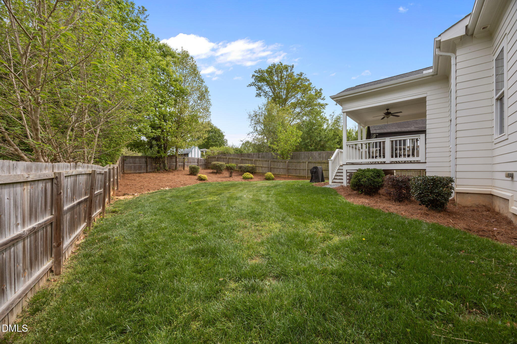 804 Hartford Road Raleigh, NC 27610 - Photo 22 of 26 a view of a house with backyard and sitting area