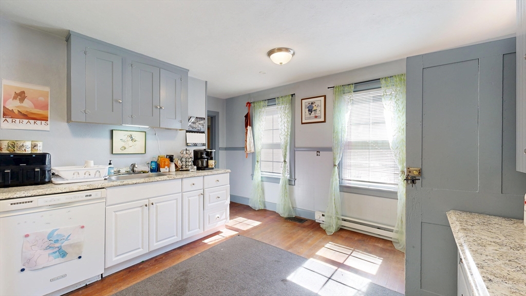 970 North Main Street Raynham, MA 02767 - Photo 13 of 42 a kitchen with white cabinets and window