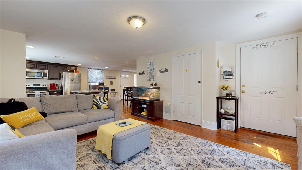 970 North Main Street Raynham, MA 02767 - Photo 22 of 42 a living room with furniture and kitchen view