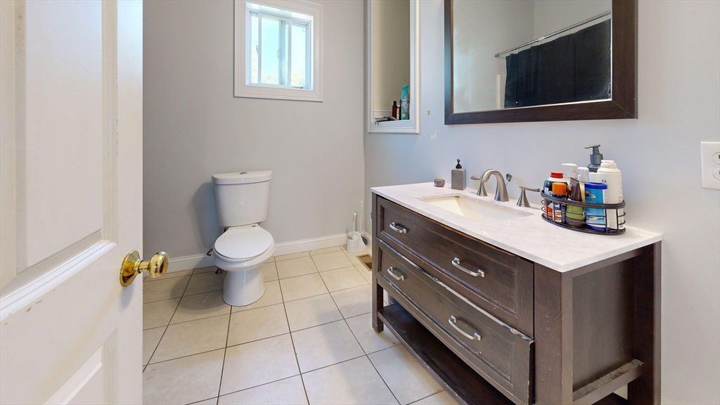 970 North Main Street Raynham, MA 02767 - Photo 28 of 42 a bathroom with a sink toilet and mirror