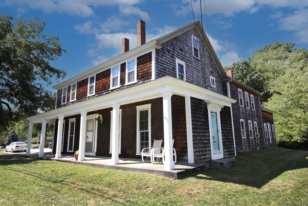 970 North Main Street Raynham, MA 02767 - Photo 32 of 42 front view of a house with a yard