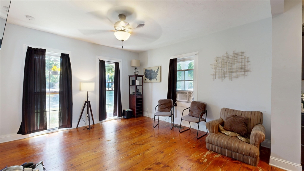 970 North Main Street Raynham, MA 02767 - Photo 5 of 42 a living room with furniture and a chandelier