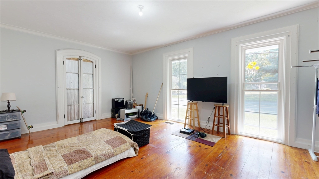 970 North Main Street Raynham, MA 02767 - Photo 8 of 42 a living room with furniture and a flat screen tv
