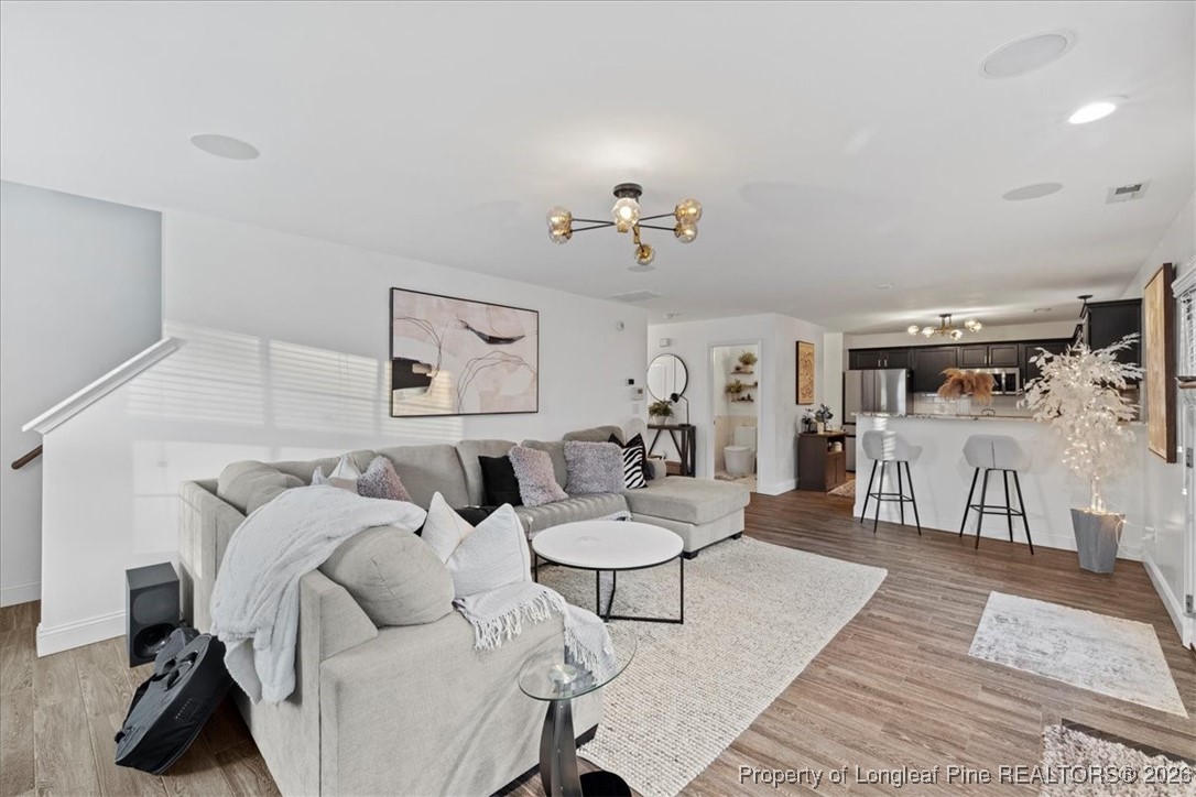 681 New Castle Lane Spring Lake, NC 28390 - Photo 22 of 50 a living room with furniture and a table
