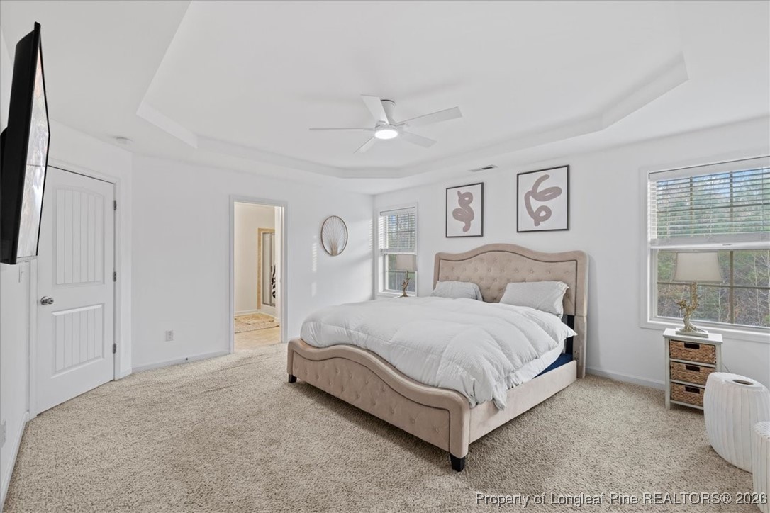 681 New Castle Lane Spring Lake, NC 28390 - Photo 27 of 50 a spacious bedroom with a bed and large windows