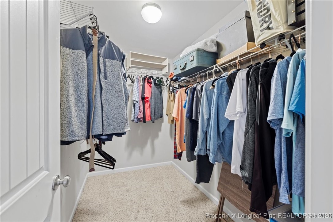 681 New Castle Lane Spring Lake, NC 28390 - Photo 29 of 50 a view of walk in closet with clothes
