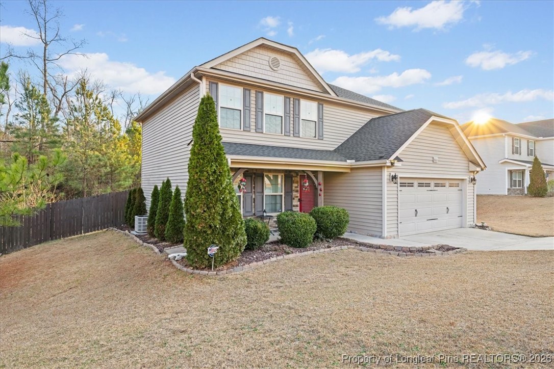681 New Castle Lane Spring Lake, NC 28390 - Photo 3 of 50 a front view of a house with garden