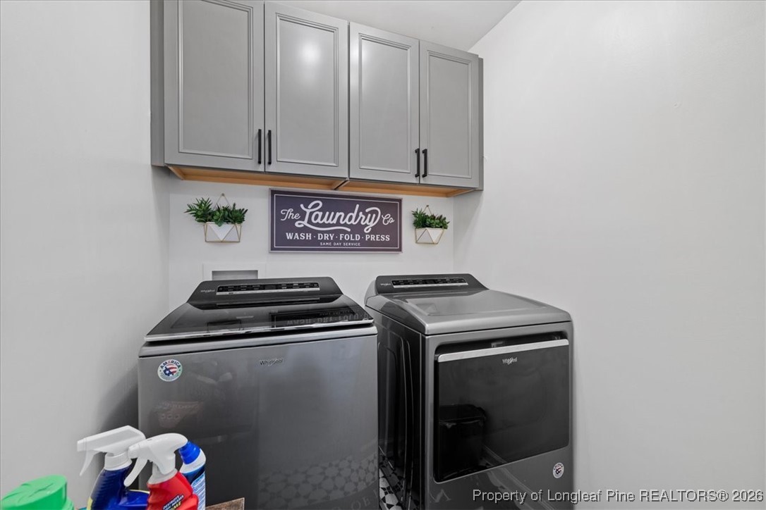 681 New Castle Lane Spring Lake, NC 28390 - Photo 35 of 50 a utility room with dryer and washer