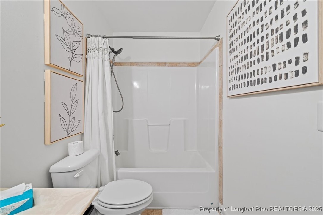 681 New Castle Lane Spring Lake, NC 28390 - Photo 37 of 50 a bathroom with a toilet and a shower