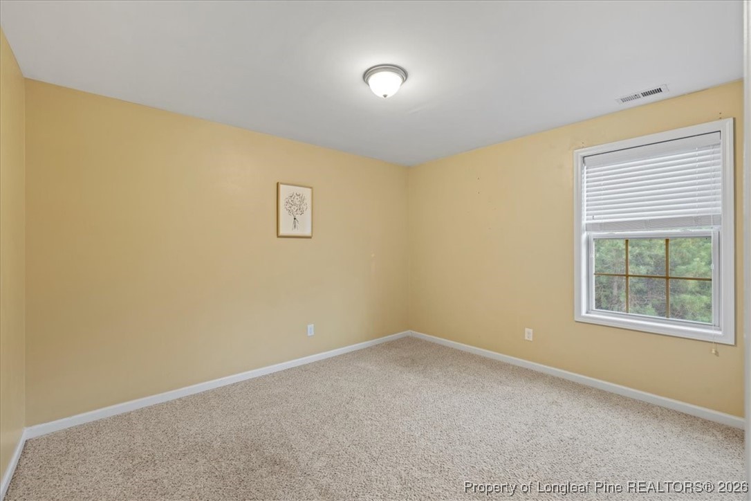 681 New Castle Lane Spring Lake, NC 28390 - Photo 40 of 50 an empty room with windows