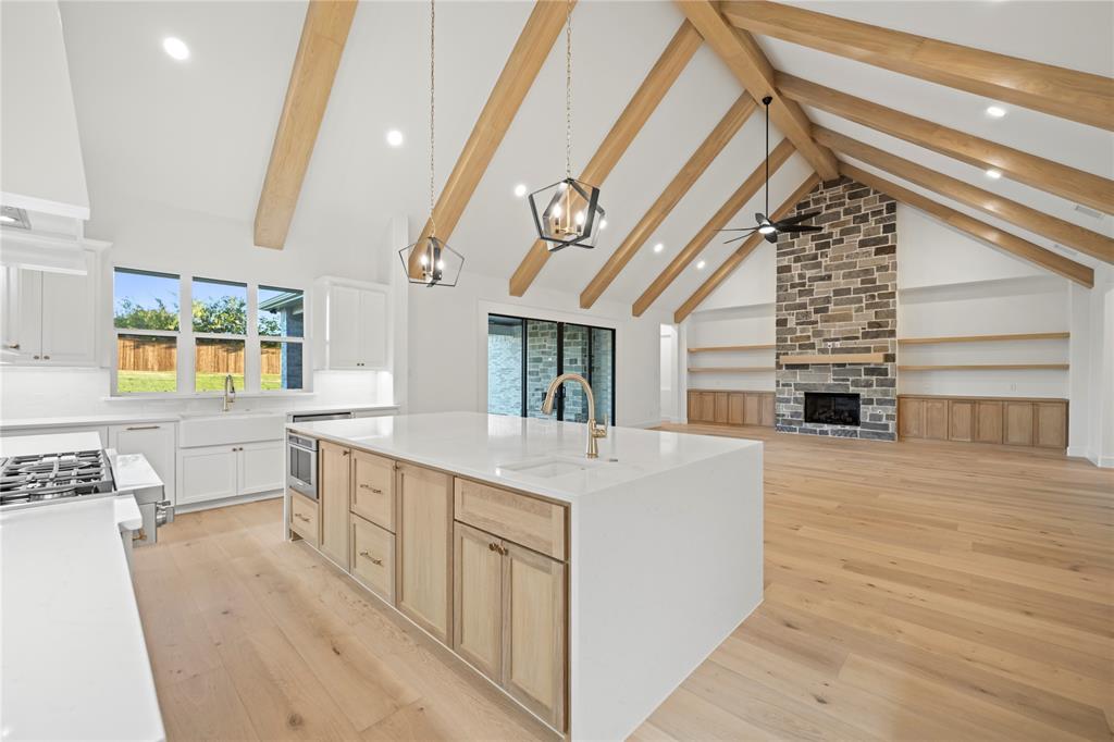 108 Bel Grand Road Haslet, TX 76052 - Photo 22 of 36 Open-concept living space with vaulted ceilings featuring exposed wood beams