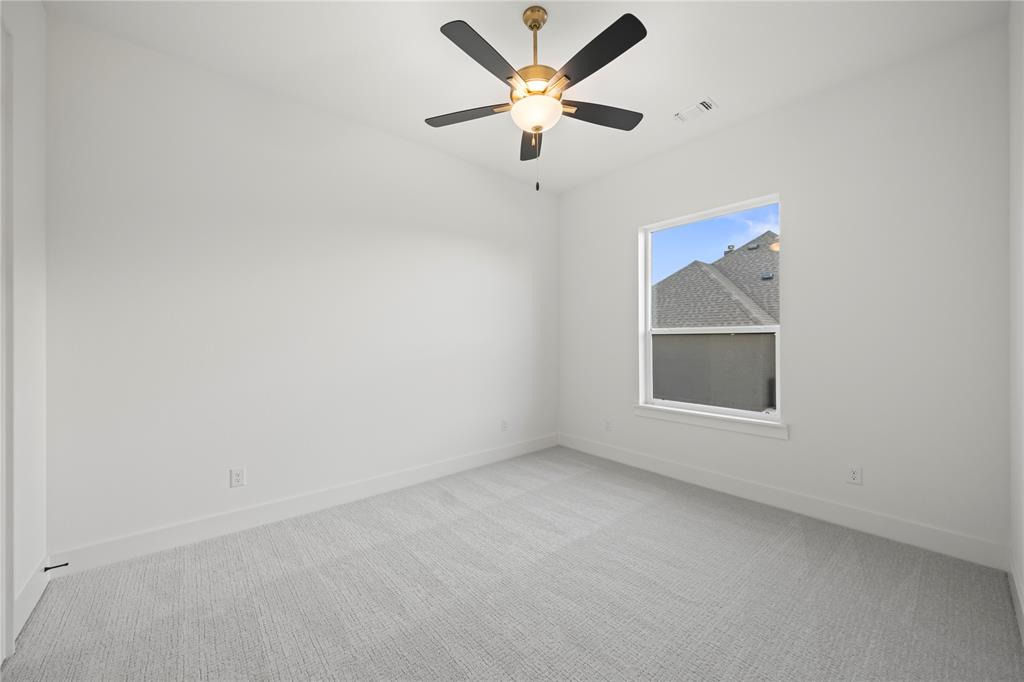 108 Bel Grand Road Haslet, TX 76052 - Photo 8 of 36 Room featuring light grey carpeting, white painted walls, and a single window with white trim