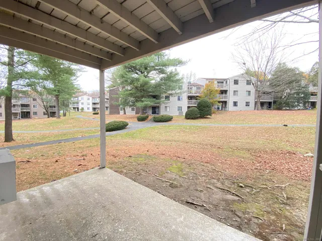 a view of a road with a yard