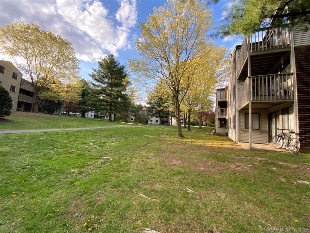 7 Padanaram Road, Unit I181 Danbury, CT 06811 - Photo 15 of 20 a view of a street with brick building in the background