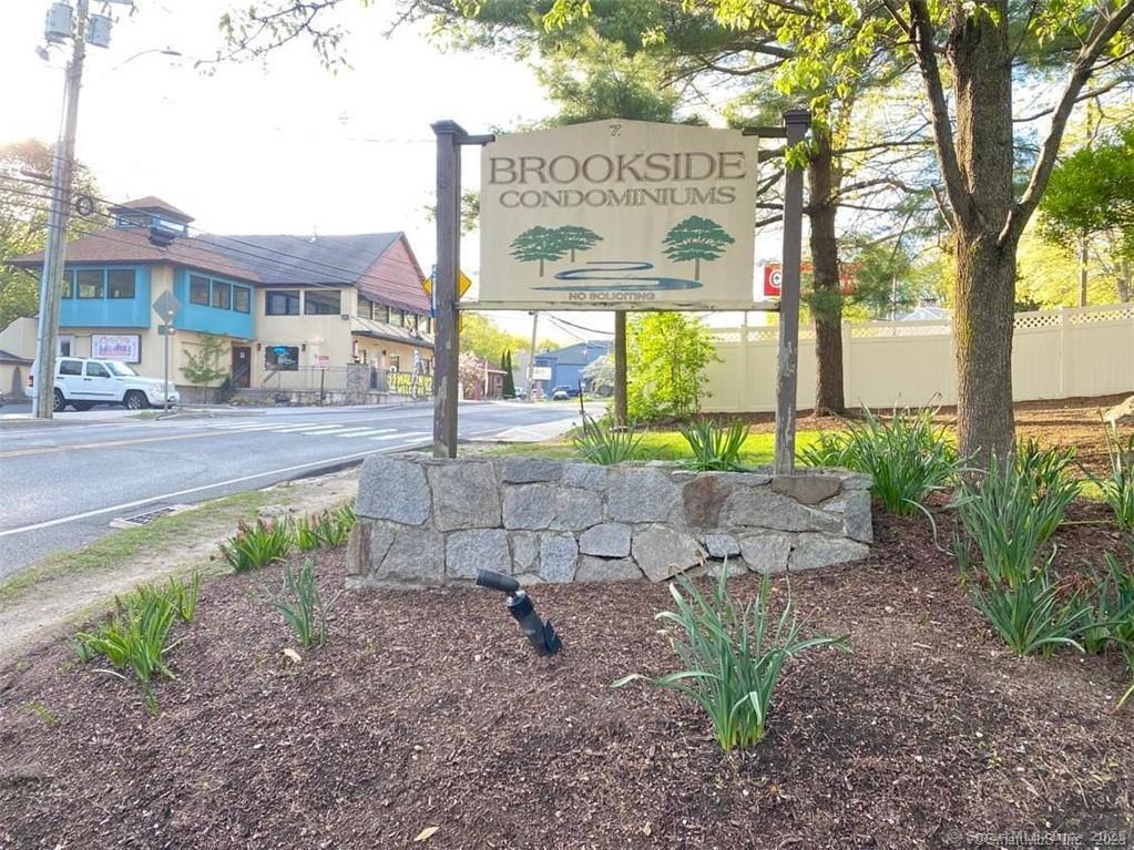 7 Padanaram Road, Unit I181 Danbury, CT 06811 - Photo 20 of 20 a front view of a house with garden