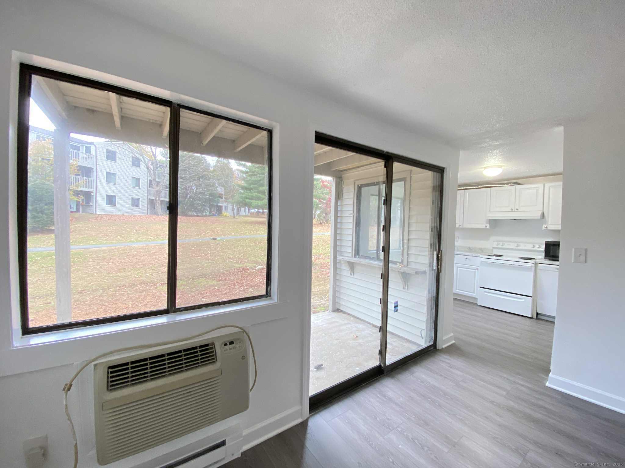 7 Padanaram Road, Unit I181 Danbury, CT 06811 - Photo 3 of 20 a view of kitchen with furniture and refrigerator