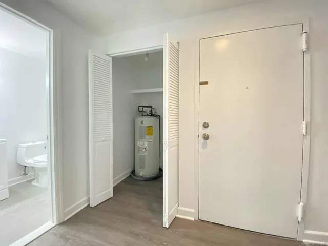 a view of a bathroom with a glass shower door
