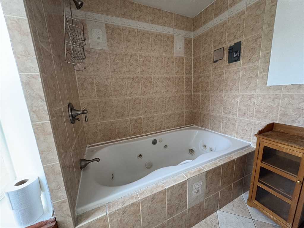 21 Juniper Street, Unit 2 Boston, MA 02119 - Photo 11 of 12 a bathroom with a bathtub and a shower