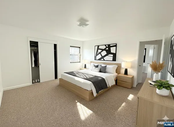 a bedroom with a bed and a couch