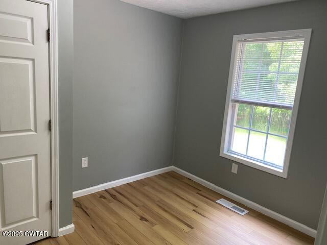 415 Mills Darden Road Lexington, TN 38351 - Photo 12 of 30 a view of empty room with wooden floor