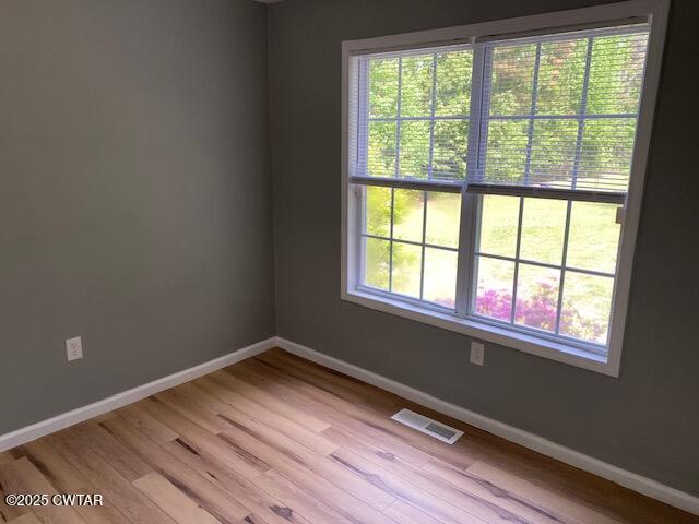 415 Mills Darden Road Lexington, TN 38351 - Photo 13 of 30 a view of an empty room with wooden floor and a window