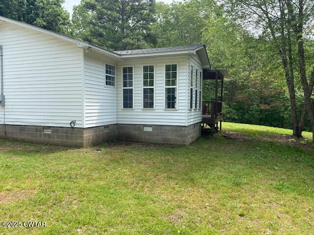 415 Mills Darden Road Lexington, TN 38351 - Photo 23 of 30 a view of a house with a backyard
