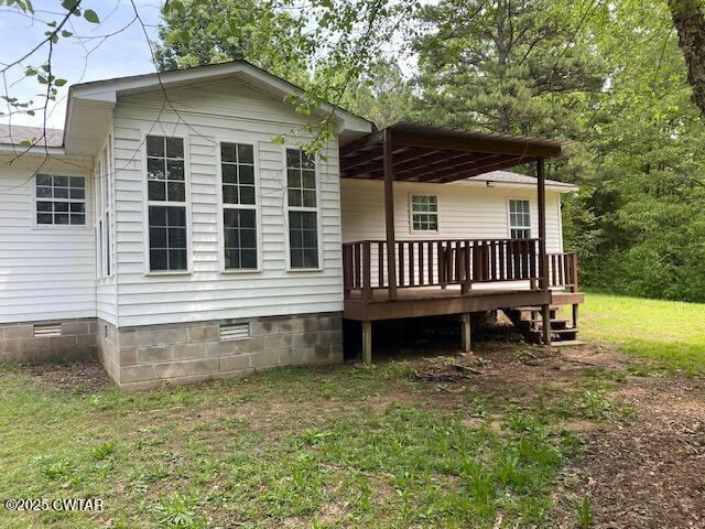 415 Mills Darden Road Lexington, TN 38351 - Photo 25 of 30 a view of a house with a yard and sitting area