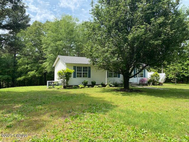 415 Mills Darden Road Lexington, TN 38351 - Photo 29 of 30 a view of a house with a big yard and large trees