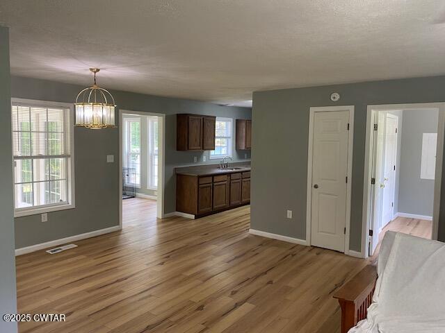415 Mills Darden Road Lexington, TN 38351 - Photo 4 of 30 a view of an empty room and window and wooden floor
