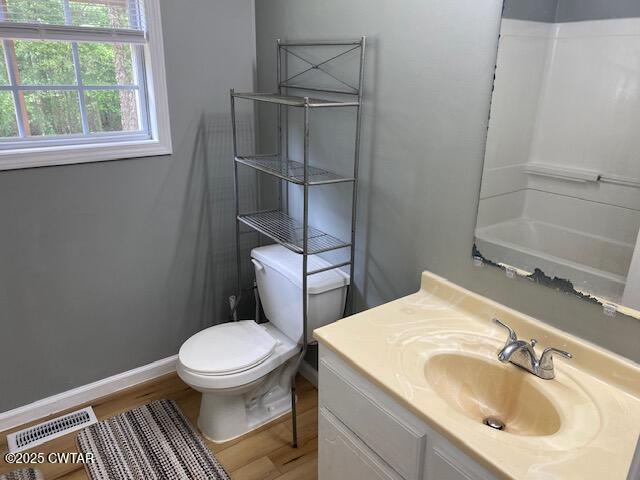 415 Mills Darden Road Lexington, TN 38351 - Photo 9 of 30 a bathroom with a sink toilet and window