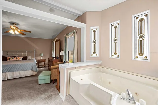 a large spacious bathroom with a tub a double vanity sink and a mirror