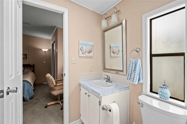 a bathroom with a sink double vanity and a mirror