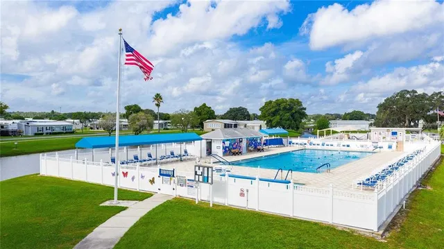 a view of swimming pool with outdoor seating
