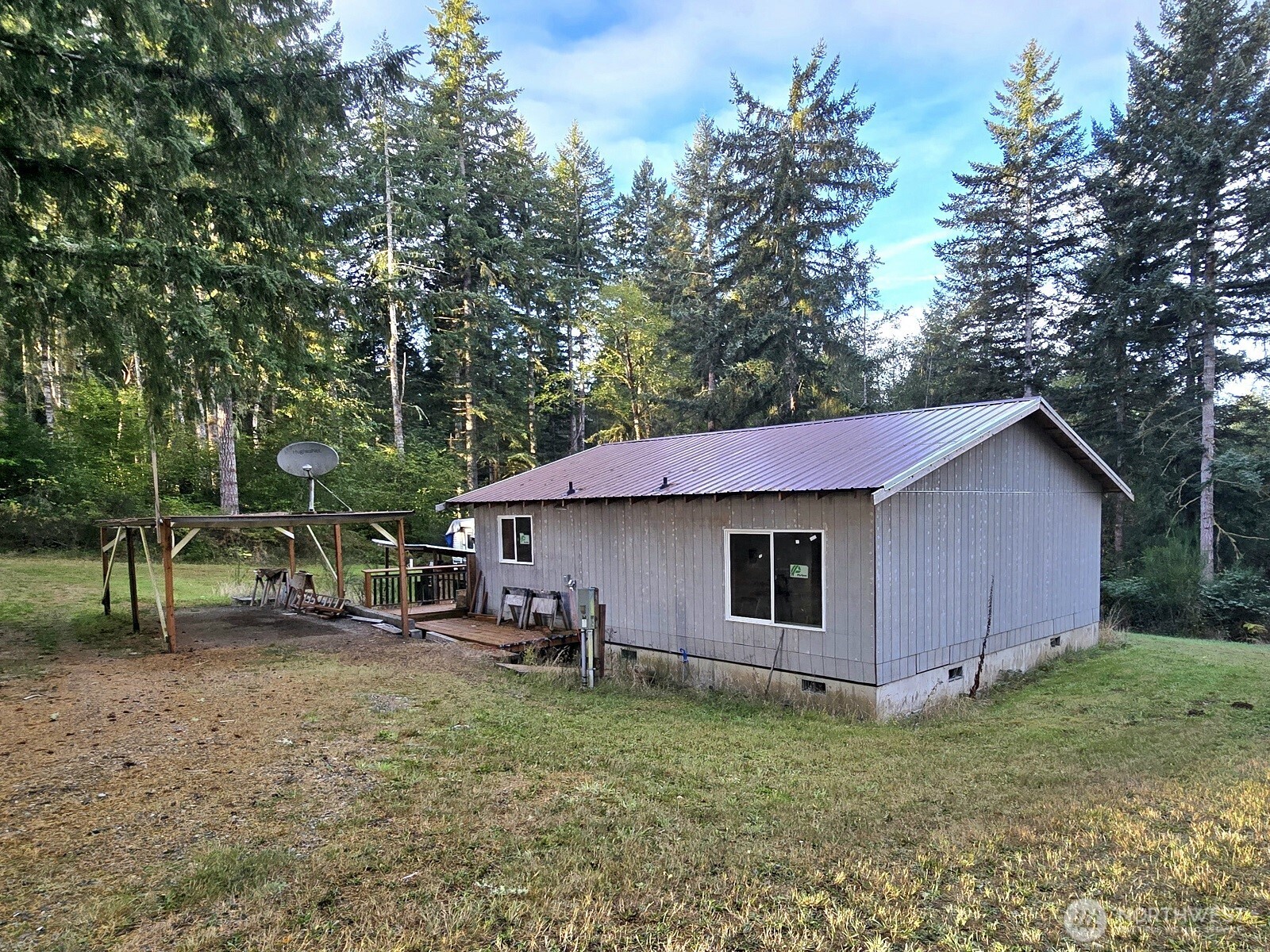 310 East Rauschert Road Grapeview, WA 98546 - Photo 2 of 11 a backyard of a house with seating space