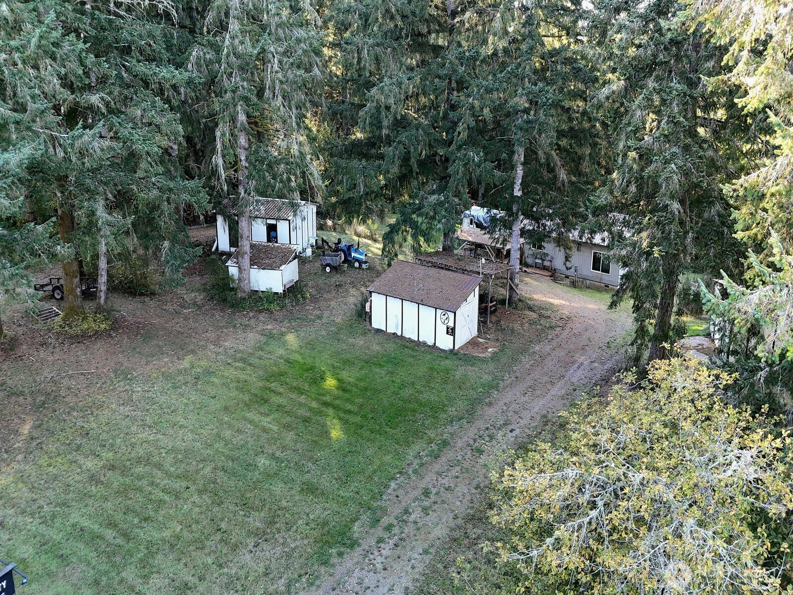 310 East Rauschert Road Grapeview, WA 98546 - Photo 3 of 11 a view of a chairs and table in the yard