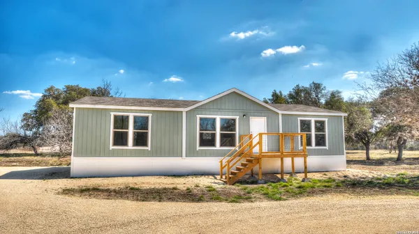 a house view with a garden space