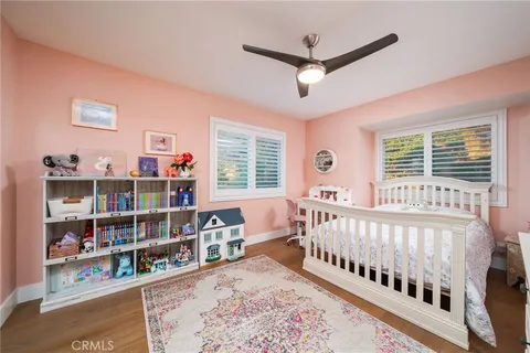 a bedroom with furniture and a window
