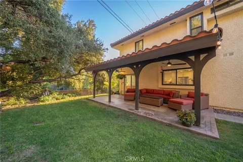 a view of yard with outdoor seating and green space