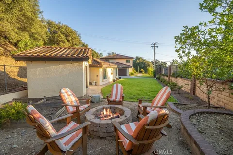 a view of a patio with table and chairs and potted plants