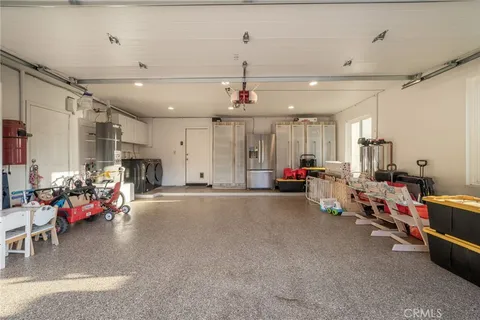 a living room with lots of furniture and a chandelier