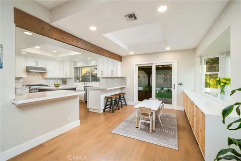 a living room with stainless steel appliances kitchen island granite countertop furniture and a kitchen view