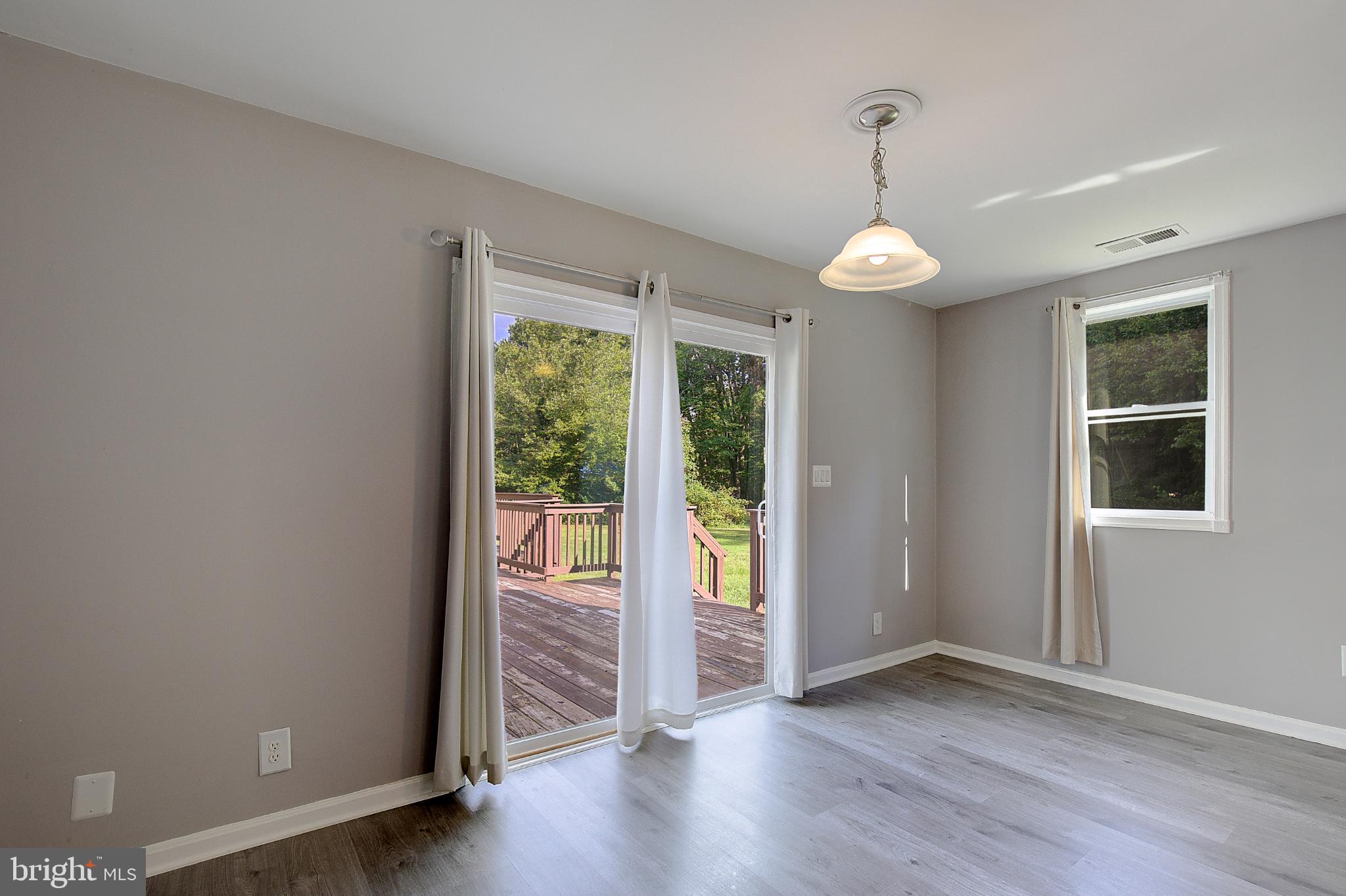 16811 Aquasco Road Brandywine, MD 20613 - Photo 13 of 34 Bright and airy space with outdoor access.