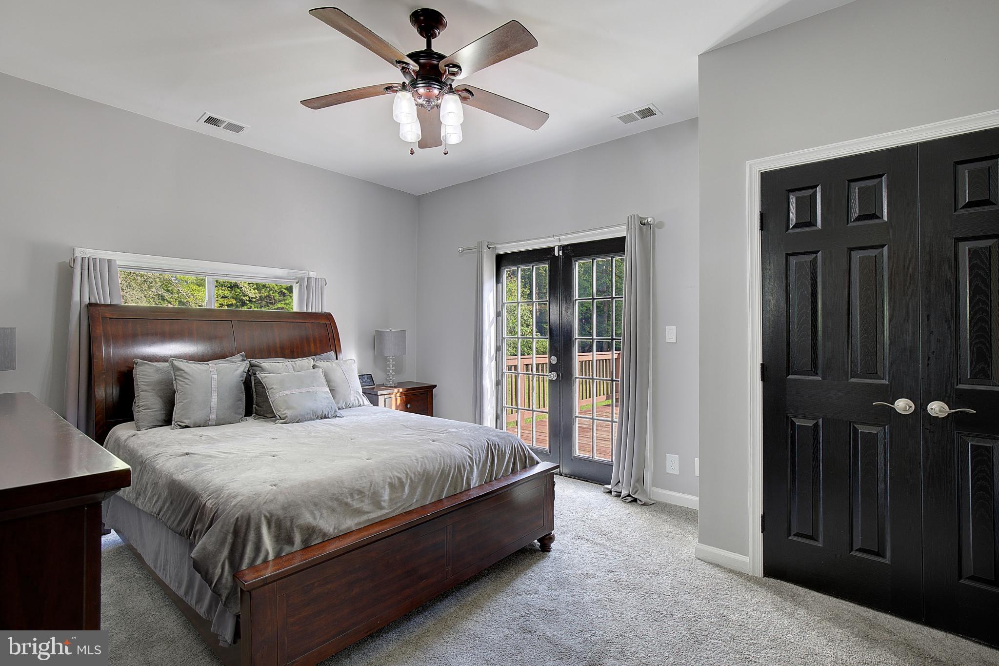 16811 Aquasco Road Brandywine, MD 20613 - Photo 21 of 34 Primary bedroom with elegant outdoor access.